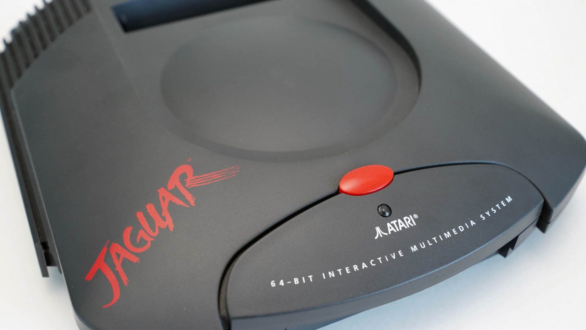 Atari Jaguar game console with red button