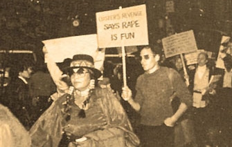Protesters holding signs during a demonstration.