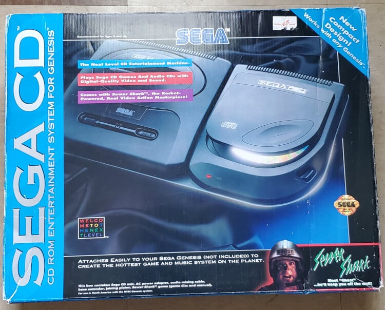 Sega CD console box featuring game and audio capabilities.