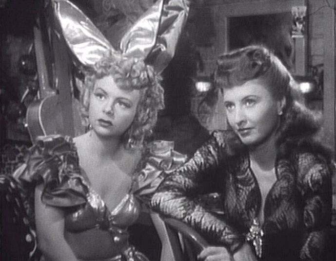 Cropped screenshot of Iris Adrian and Barbara Stanwyck from the film Lady of Burlesque .