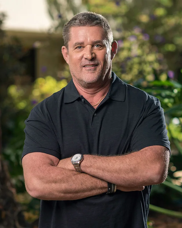 Gex Enter the Gecko director Glen Schofield standing outdoors with his arms folded