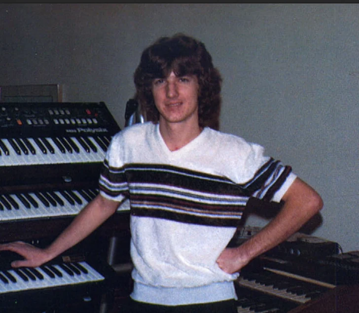 Mike Livesay in an early photograph surrounded by electronic keyboards