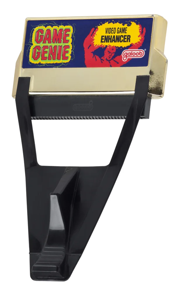 Gold NES Game Genie cartridge adapter sold by Galoob