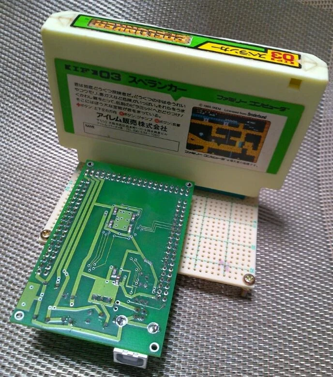 Famicom cartridge connected to cartridge dumping hardware associated with Pasofami