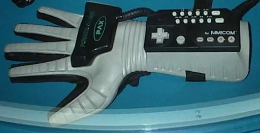 Japanese Power Glove bearing PAX branding on the forearm keypad